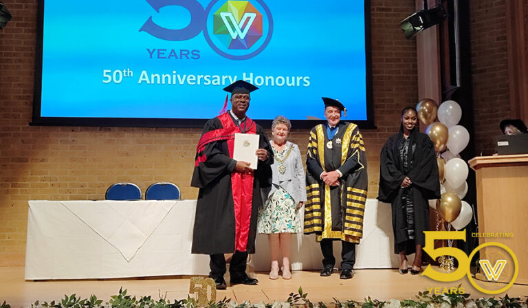 John Onugha poses for his doctorate degree
