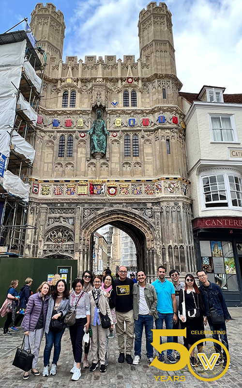 Delegates posing in front of Christ Church Gate to the Cathedral